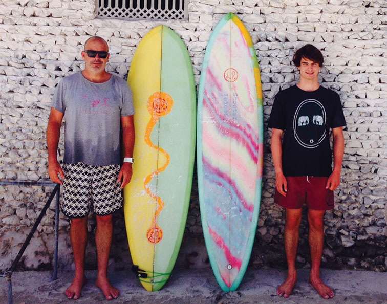 When Andrew Daddo isn't playing golf, he's carving surfboards with son, Felix.