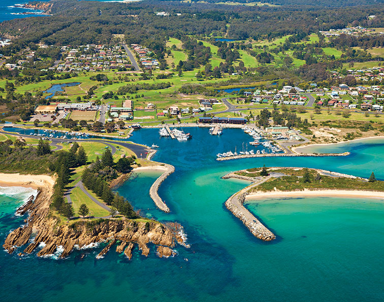 An aerial shot of Bermagui highlights its colourful port, a famous region for deep-sea fishing. 