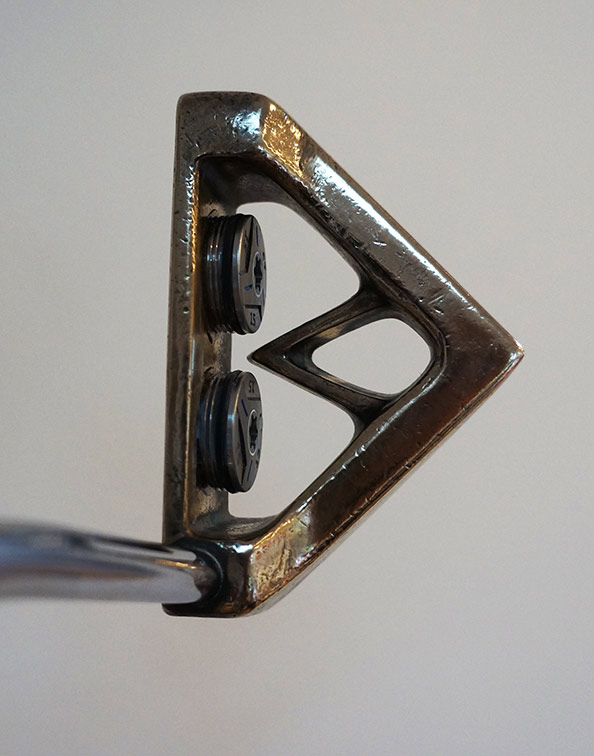 Andrew Daddo has glued tungsten weights from a newer, fancier model to the  back of his old  Align putter.