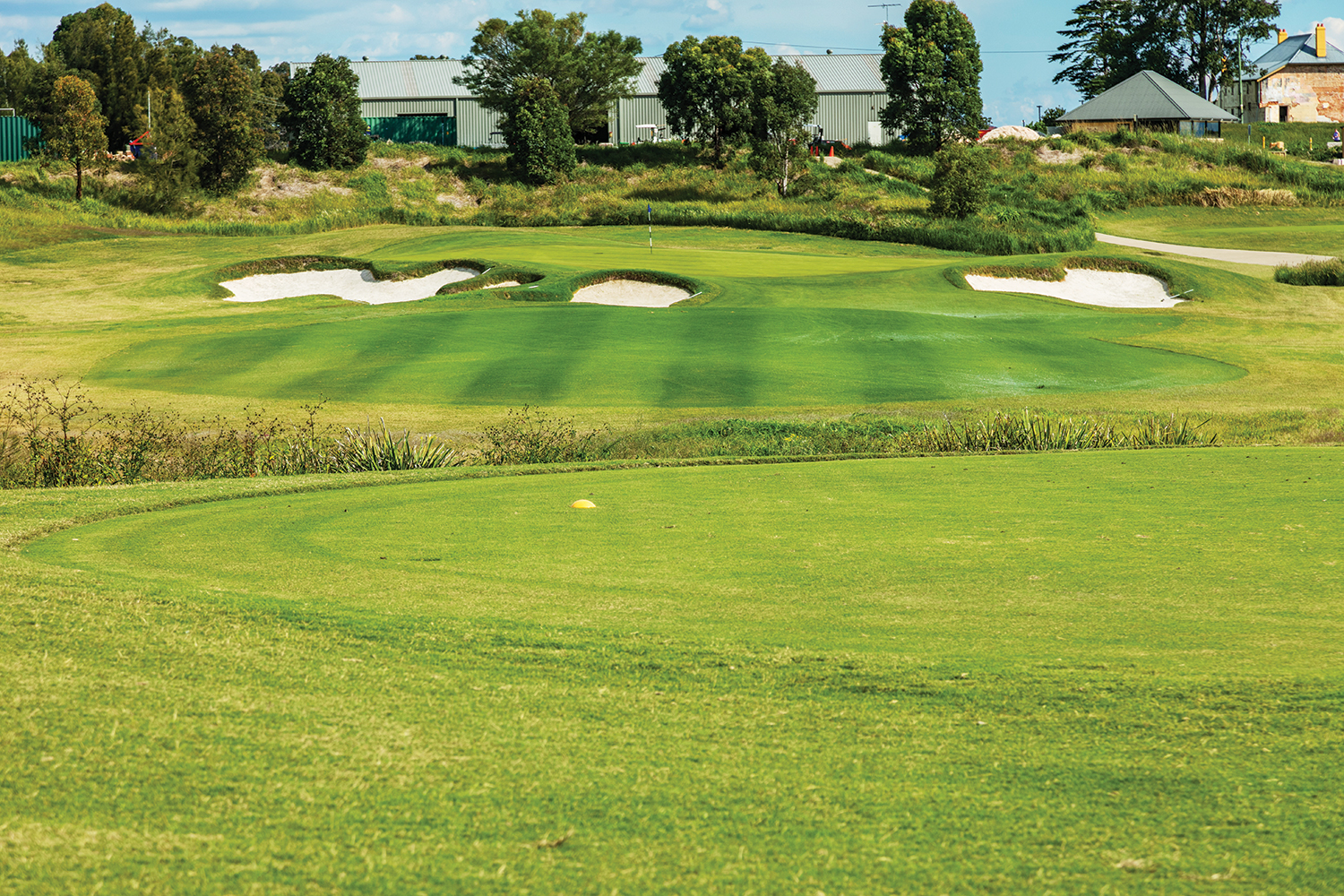The 14th is a sleeper par 3, located near the high-quality practice facilities [above].