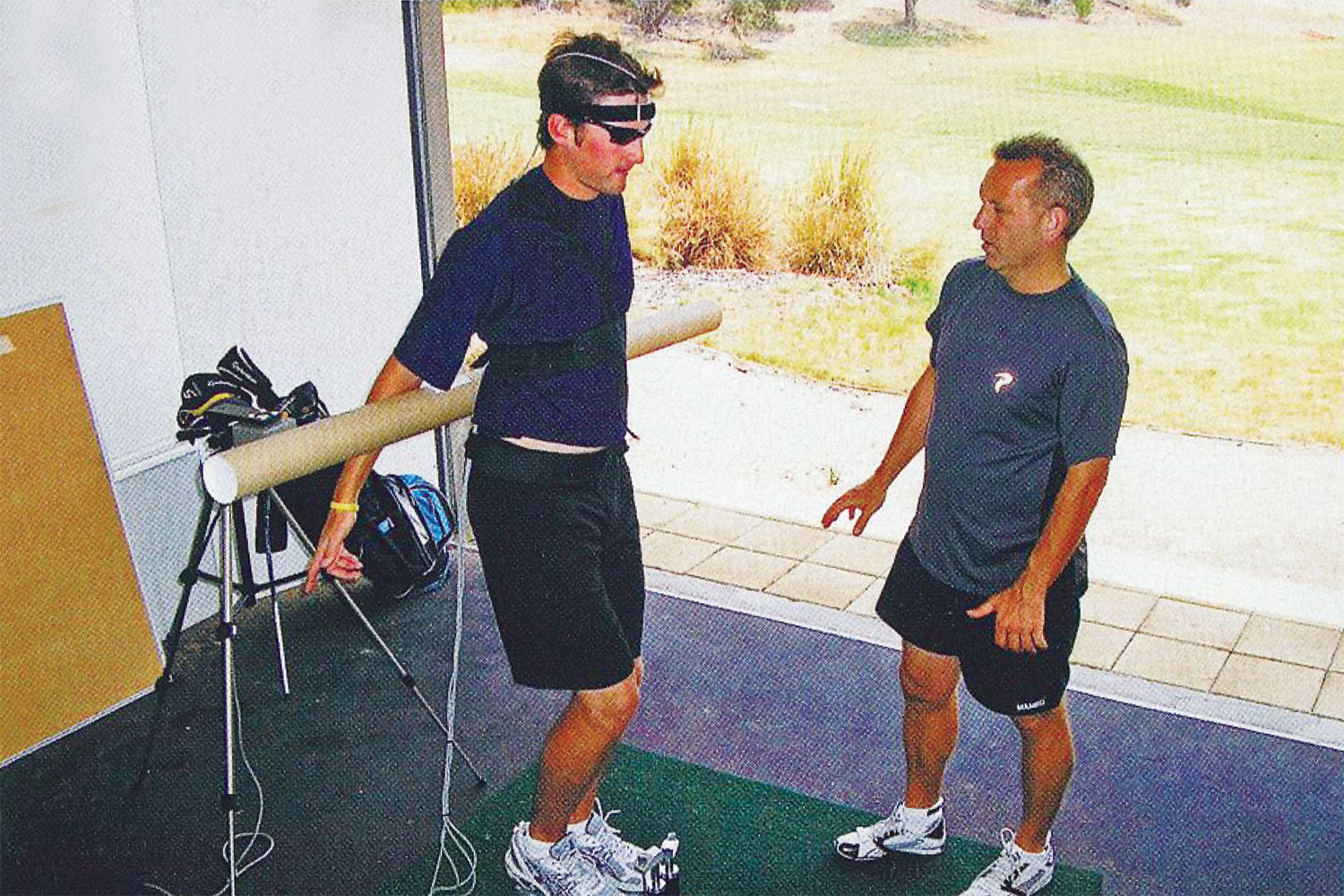 Sim and McMaster at work before the golf physiotherapist’s untimely passing.
