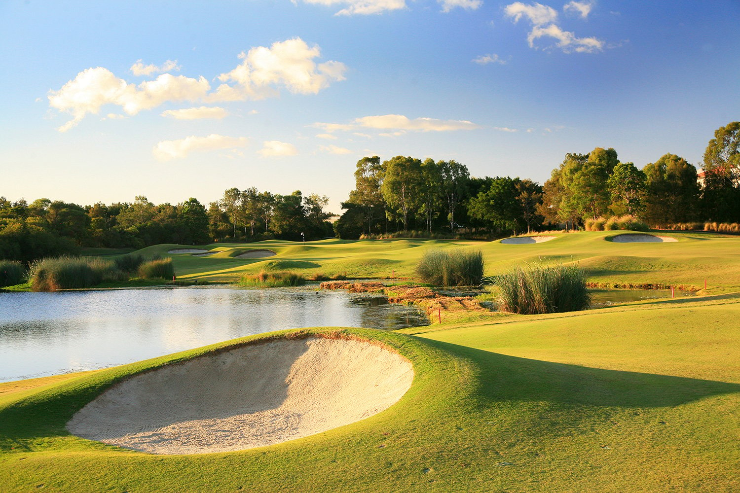 Links Hope Island on Queensland’s Gold Coast intermingles the tenacious Thomson pot bunkers  with water hazards and tropical vegetation.