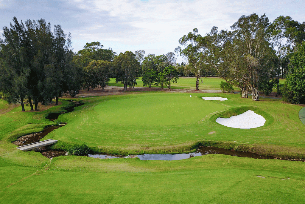 Concord Golf Club: The green at the eighth hole, a reinstated par 5, is more open but remains encircled by danger.