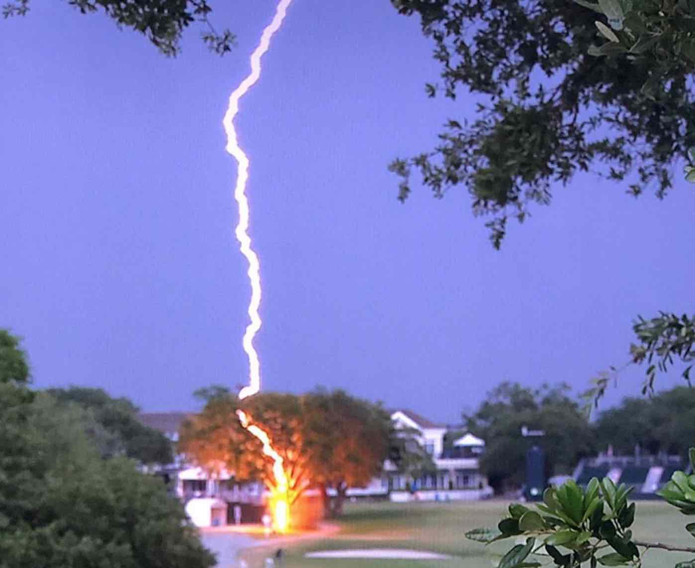 Watch the insane lightning bolt that struck a tree off the 18th hole at