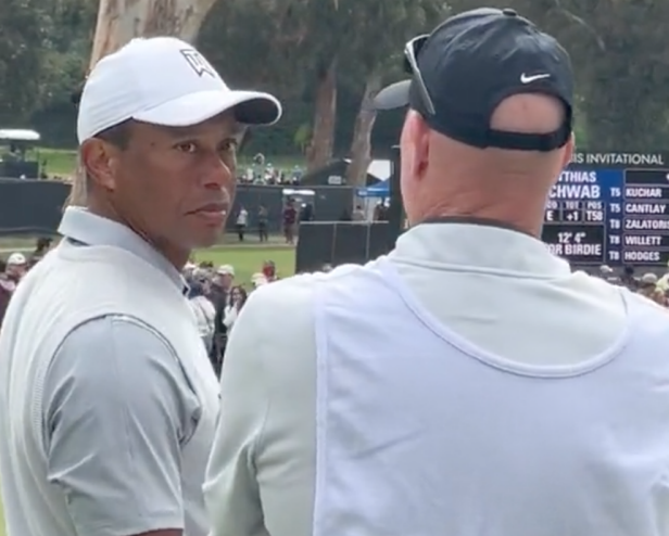 adorable-clip-shows-caddie-joe-lacava-notifying-tiger-woods-of-young-fan’s-‘bucket-list’-poster