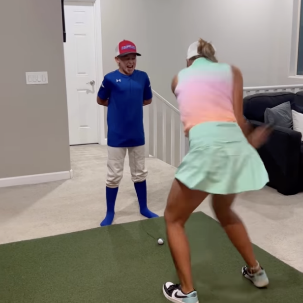 brave-kid-lets-big-sister-yank-out-his-loose-tooth-by-blasting-golf-shot