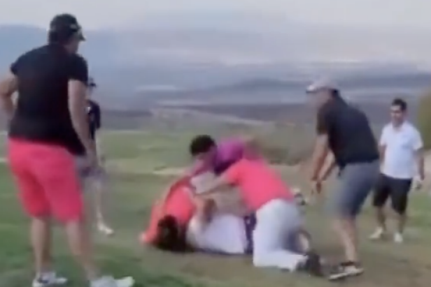 chaotic-golf-fight-ends-in-dog-pile,-broken-equipment-and-a-golf-club-being used-as-a weapon