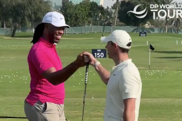 Watch future Hall of Famer Larry Fitzgerald get a quick wedge tip from Rory McIlroy at the Dubai Invitational