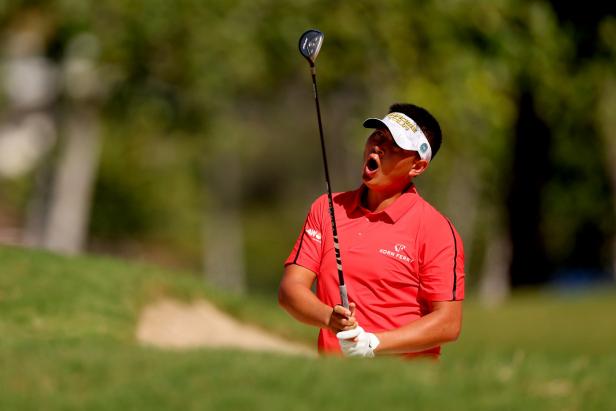 while-co-leading-on-72nd-hole,-carl-yuan-sails-ball-toward-grandstand,-receives-favorable-free-drop