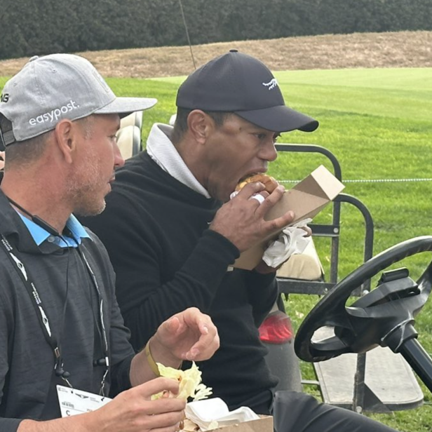 tiger-woods-going-to-town-on-an-in-n-out-burger-is-the-most-relatable-he’s-ever-been