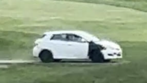 vandal-drives-car-onto-golf-course,-nearly-hits-players-and-damages-greens