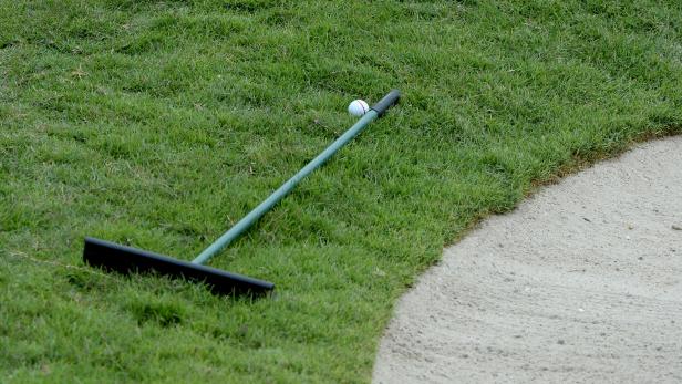 Rules Review: My ball is up against a bunker rake. Where do I play my ...